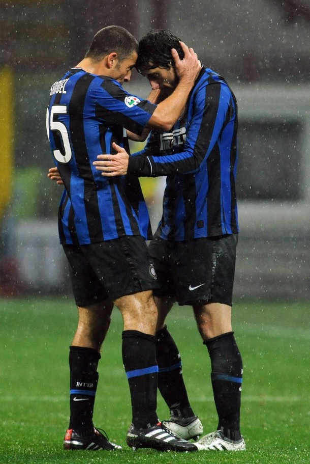 Samuel and Milito share a special moment