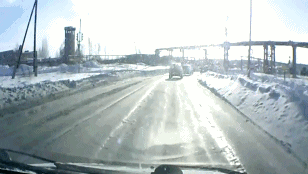 Russia-dashboard-cam-tank-drives-across-road-snow-1359329911c_medium