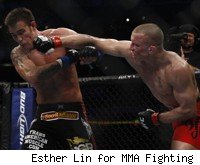GSP punches Jake Shields at UFC 129.